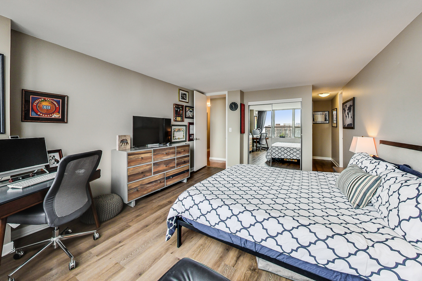 655 West Irving Park Road, Unit 2210 Chicago, IL 60613 - Photo 13 of 38 a bedroom with a bed and a flat screen tv