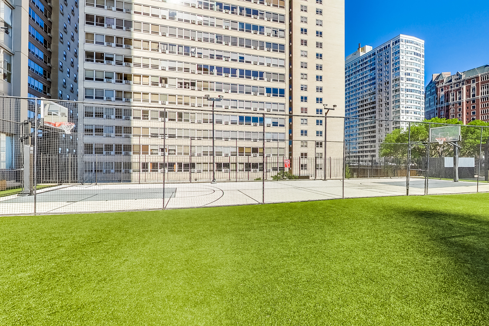 655 West Irving Park Road, Unit 2210 Chicago, IL 60613 - Photo 31 of 38 a view of building with swimming pool