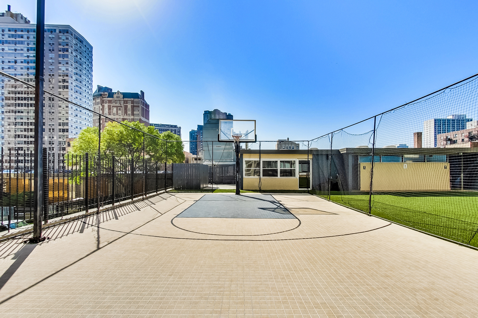 655 West Irving Park Road, Unit 2210 Chicago, IL 60613 - Photo 32 of 38 a view of a patio with a table and chairs under an umbrella
