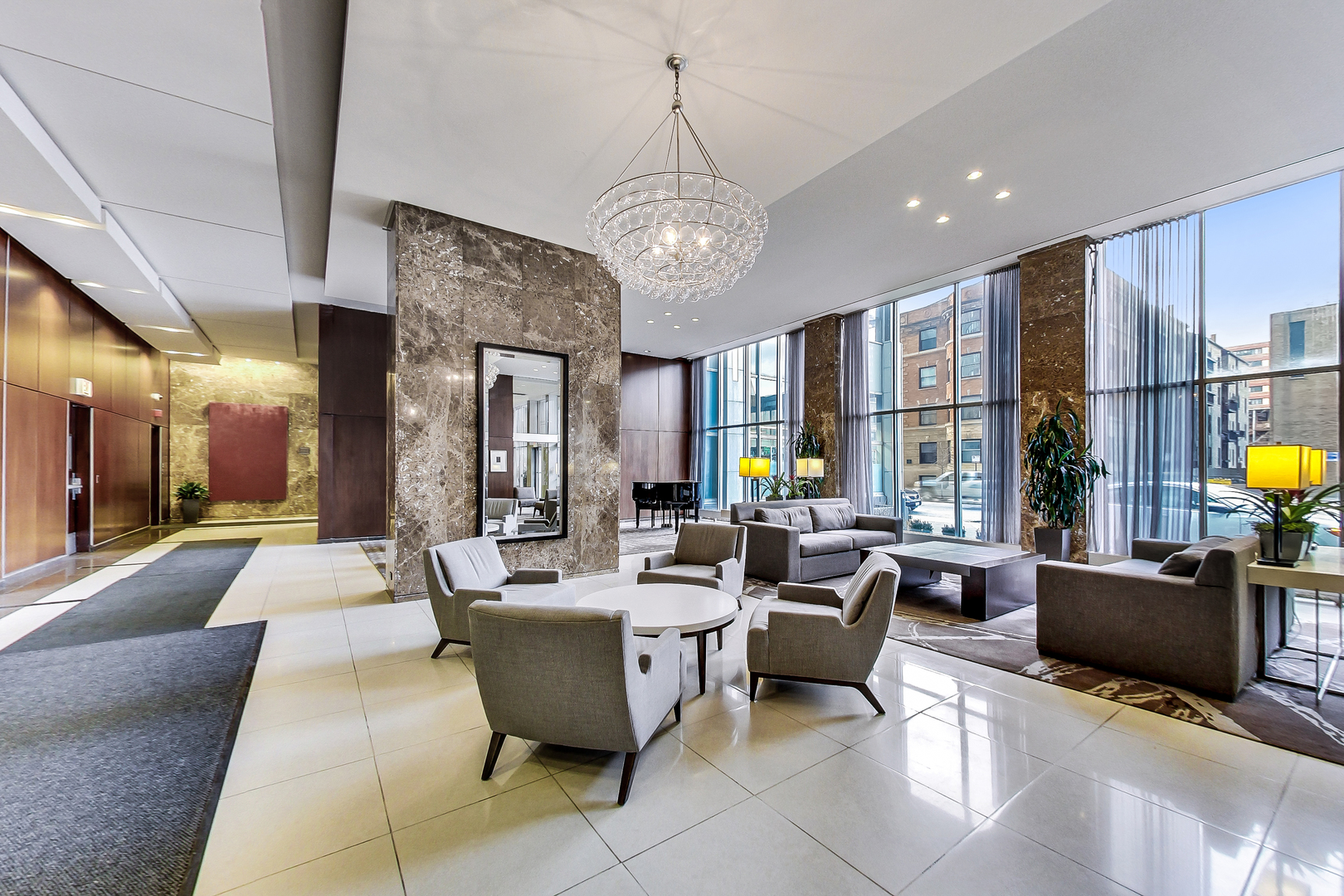 655 West Irving Park Road, Unit 2210 Chicago, IL 60613 - Photo 37 of 38 a living room with lots of furniture and chandelier