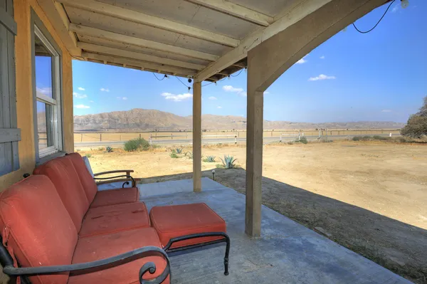 a outdoor living space with furniture and city view