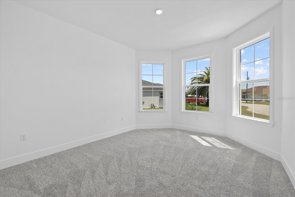 7443 South Seagrape Road Punta Gorda, FL 33955 - Photo 22 of 44 a view of an empty room with a window