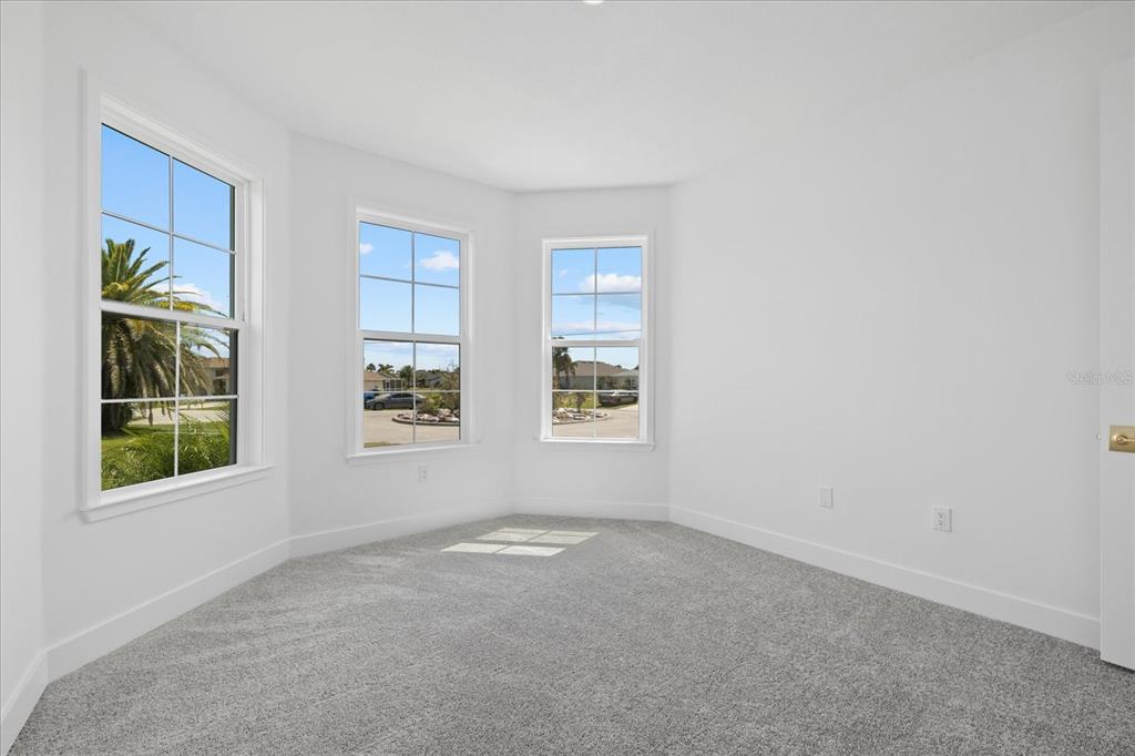 7443 South Seagrape Road Punta Gorda, FL 33955 - Photo 23 of 44 an empty room with windows
