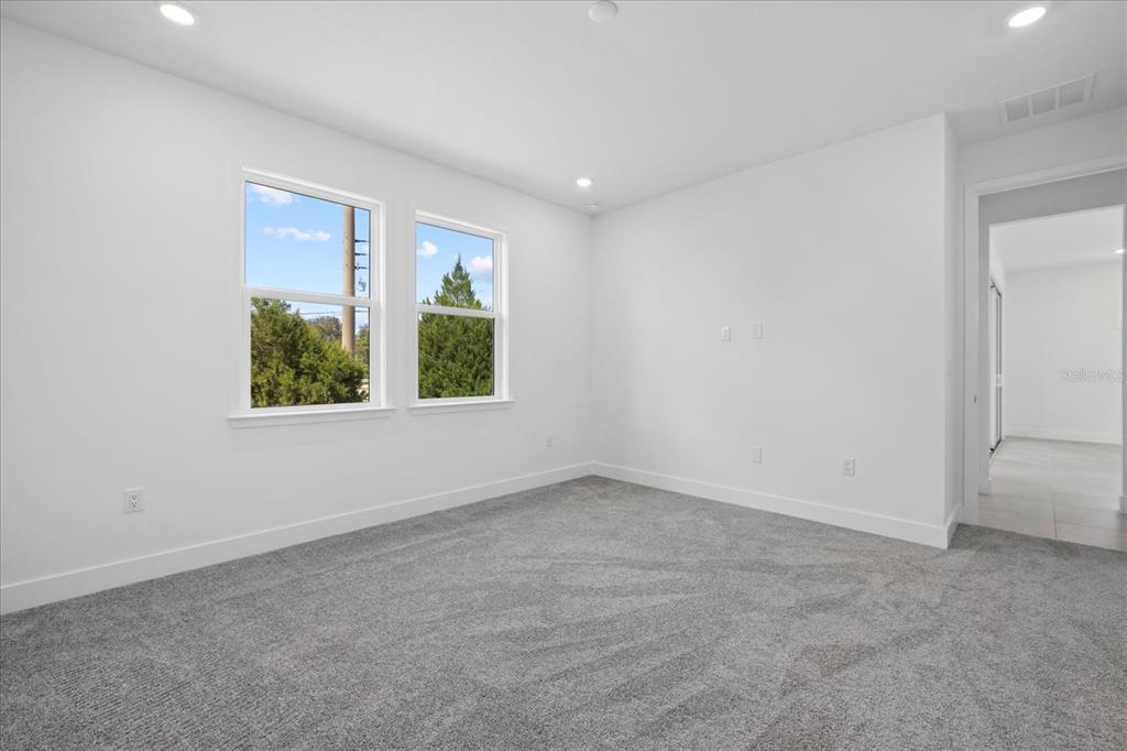 7443 South Seagrape Road Punta Gorda, FL 33955 - Photo 26 of 44 an empty room with a window