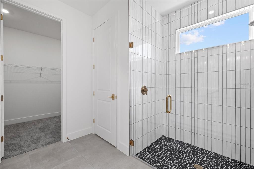 7443 South Seagrape Road Punta Gorda, FL 33955 - Photo 29 of 44 a bathroom with a shower