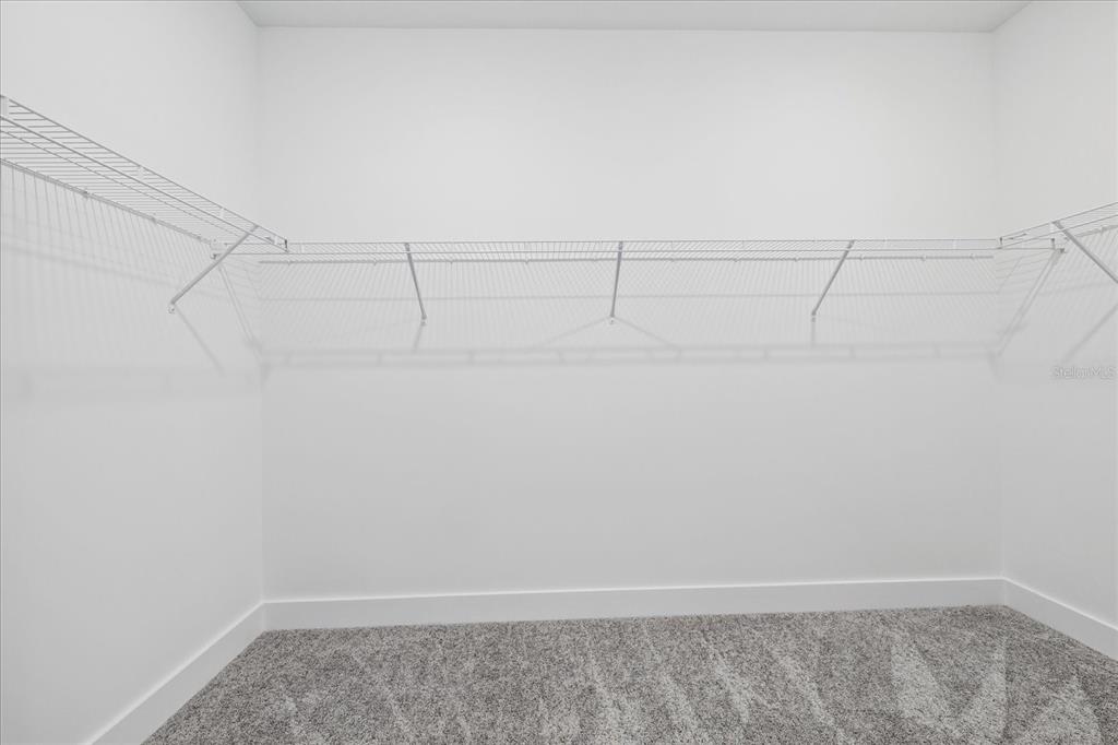 7443 South Seagrape Road Punta Gorda, FL 33955 - Photo 30 of 44 a view of a room with racks on the wall