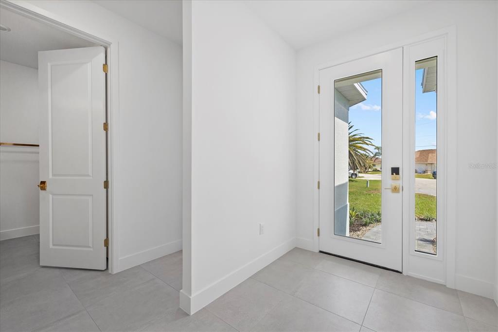 7443 South Seagrape Road Punta Gorda, FL 33955 - Photo 3 of 44 an empty room with windows and closet