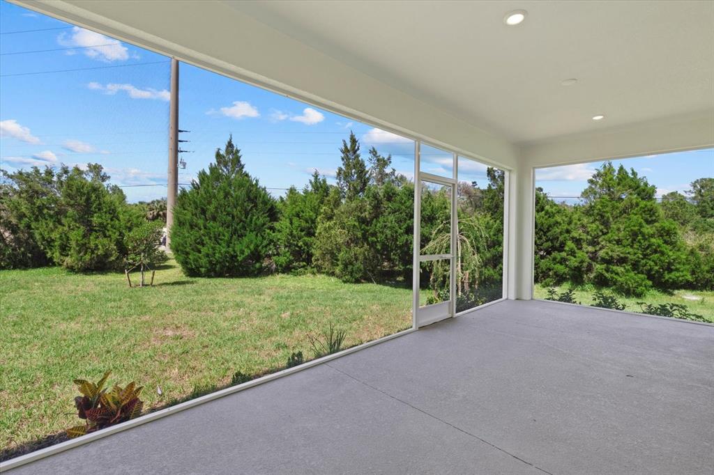 7443 South Seagrape Road Punta Gorda, FL 33955 - Photo 31 of 44 a view of a garden from a window