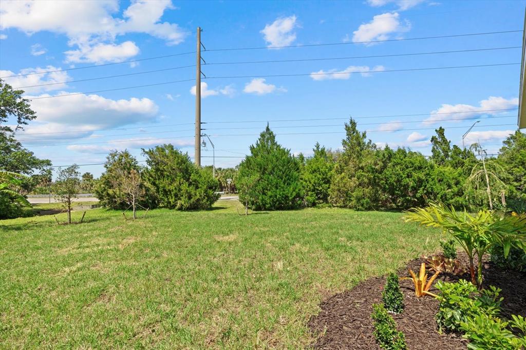 7443 South Seagrape Road Punta Gorda, FL 33955 - Photo 36 of 44 a view of a big yard with potted plants