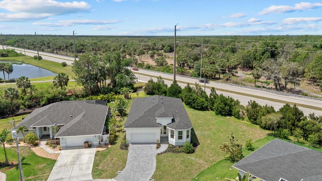 7443 South Seagrape Road Punta Gorda, FL 33955 - Photo 41 of 44 an aerial view of multiple house