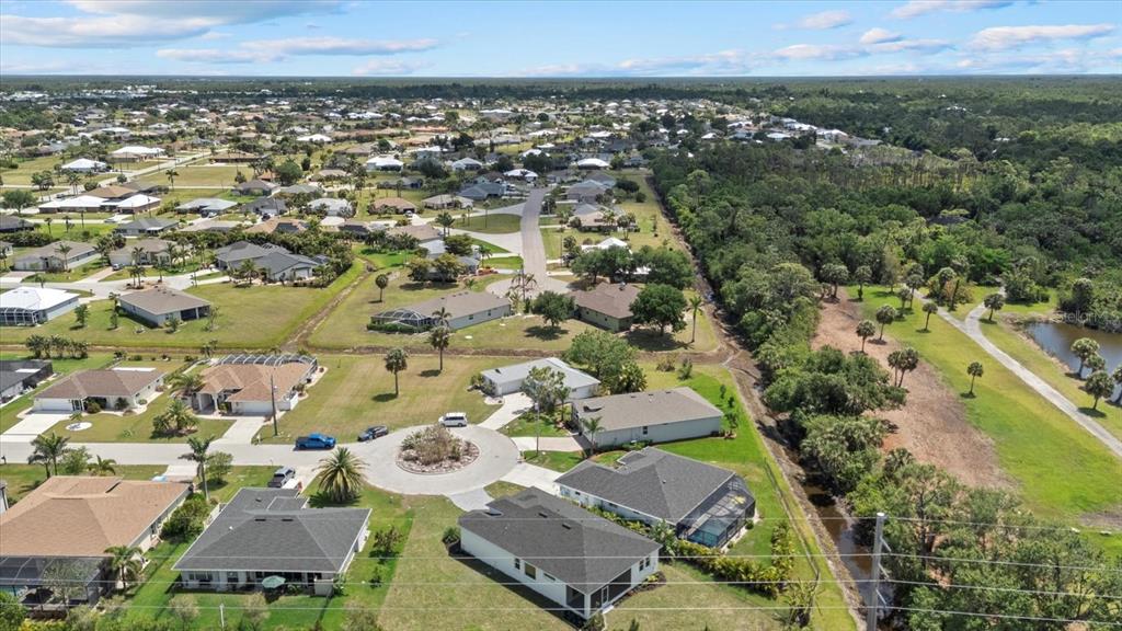 7443 South Seagrape Road Punta Gorda, FL 33955 - Photo 43 of 44 an aerial view of residential houses with outdoor space