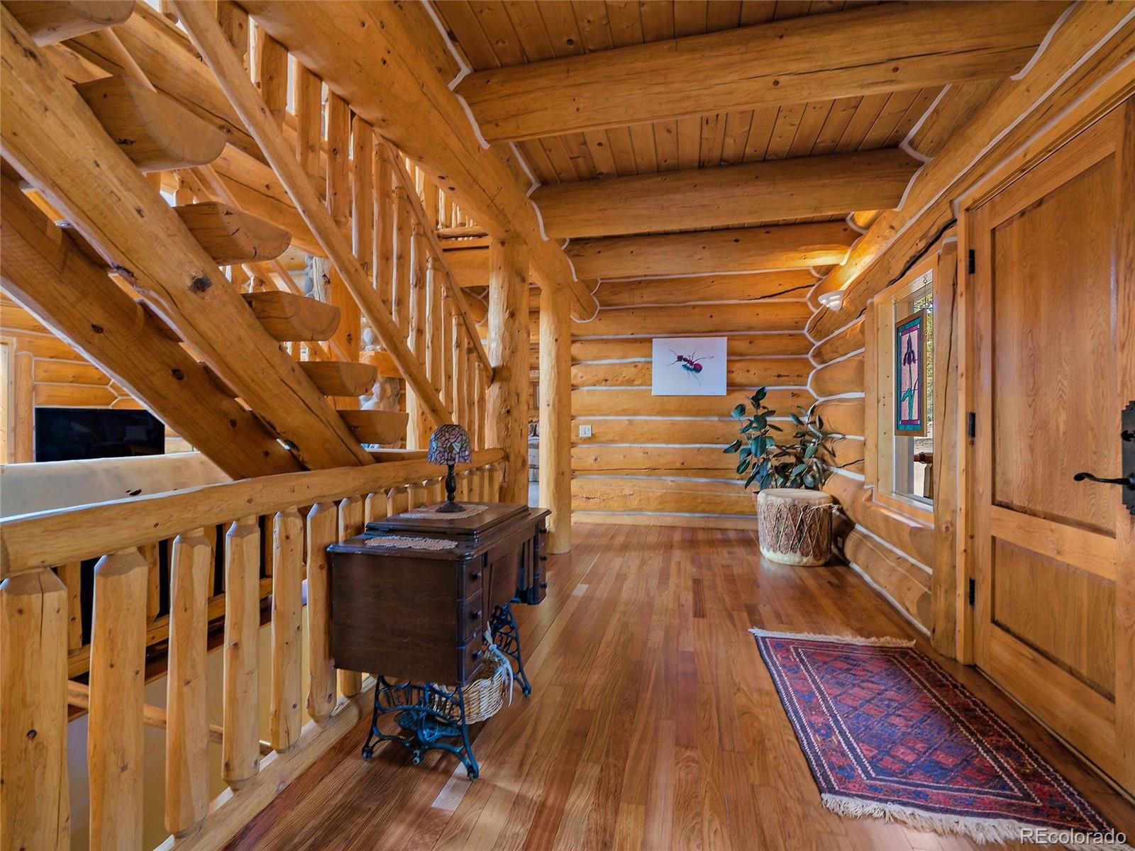 96 Six Bits Street Bailey, CO 80421 - Photo 12 of 40 a view of entryway with wooden floor