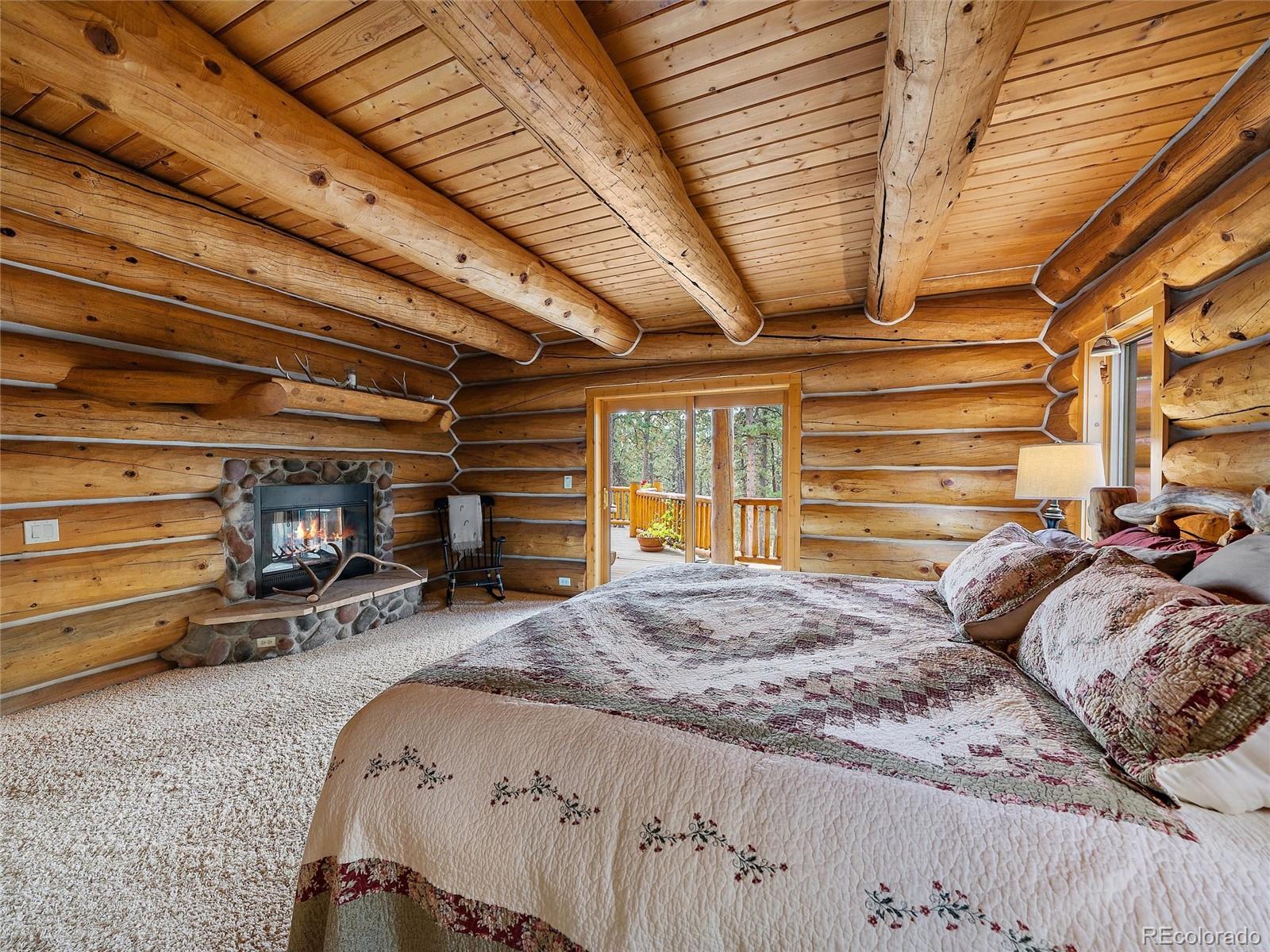 96 Six Bits Street Bailey, CO 80421 - Photo 20 of 40 a bed in a room next to a window