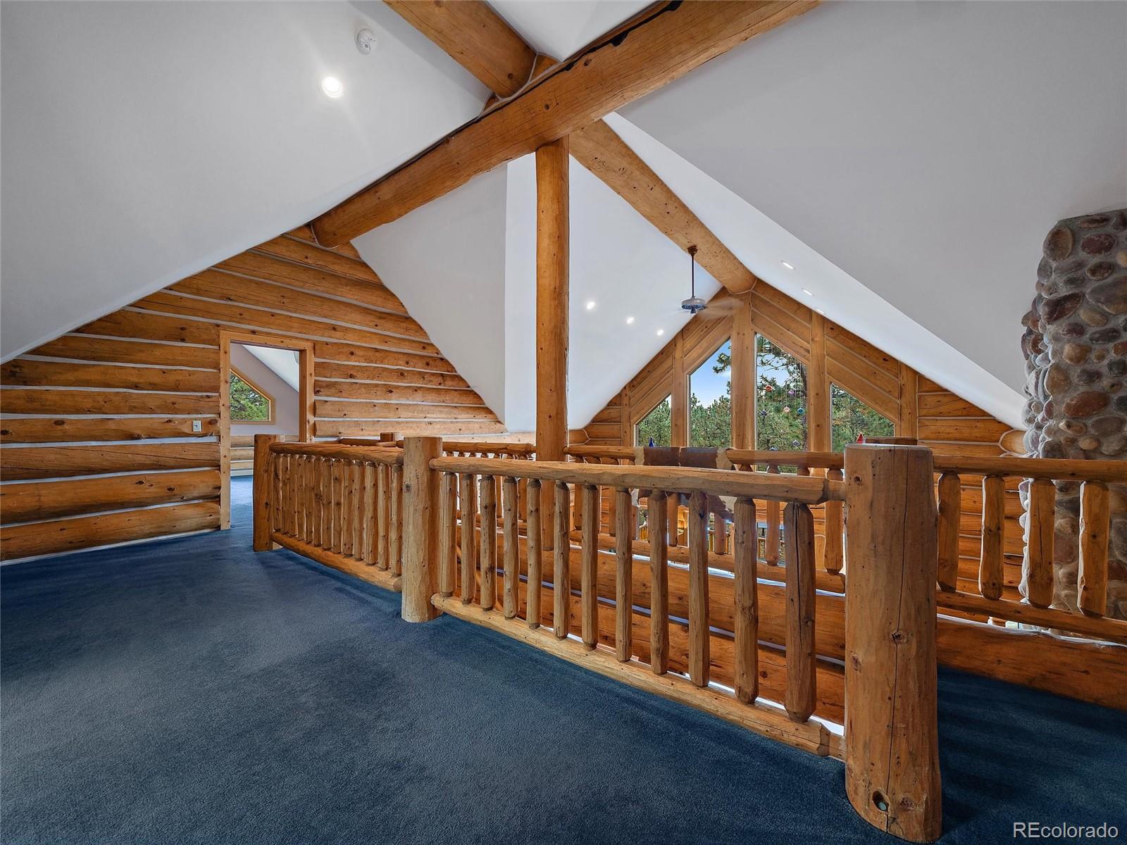 96 Six Bits Street Bailey, CO 80421 - Photo 25 of 40 a view of a porch with wooden floor and stairs