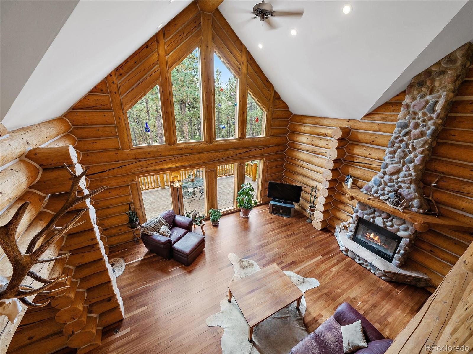 96 Six Bits Street Bailey, CO 80421 - Photo 27 of 40 a living room with furniture and a fireplace