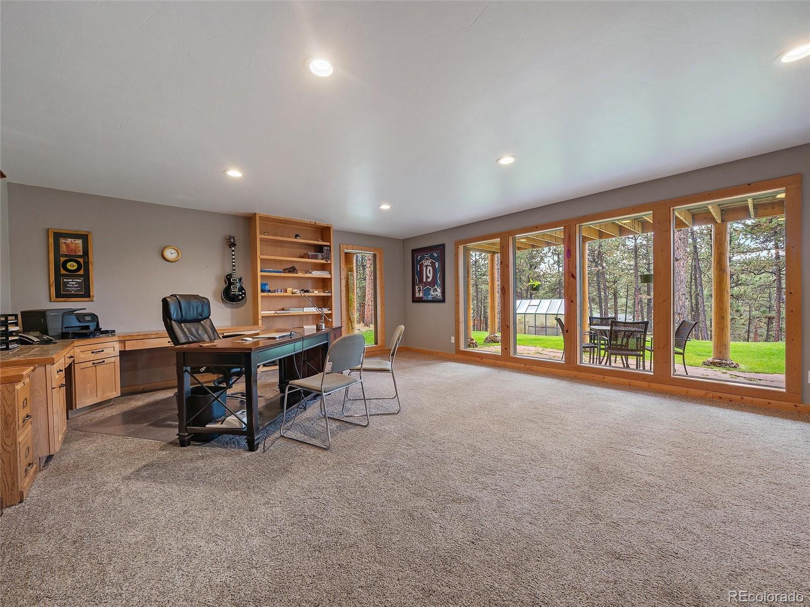 96 Six Bits Street Bailey, CO 80421 - Photo 34 of 40 a living room with furniture and a large window
