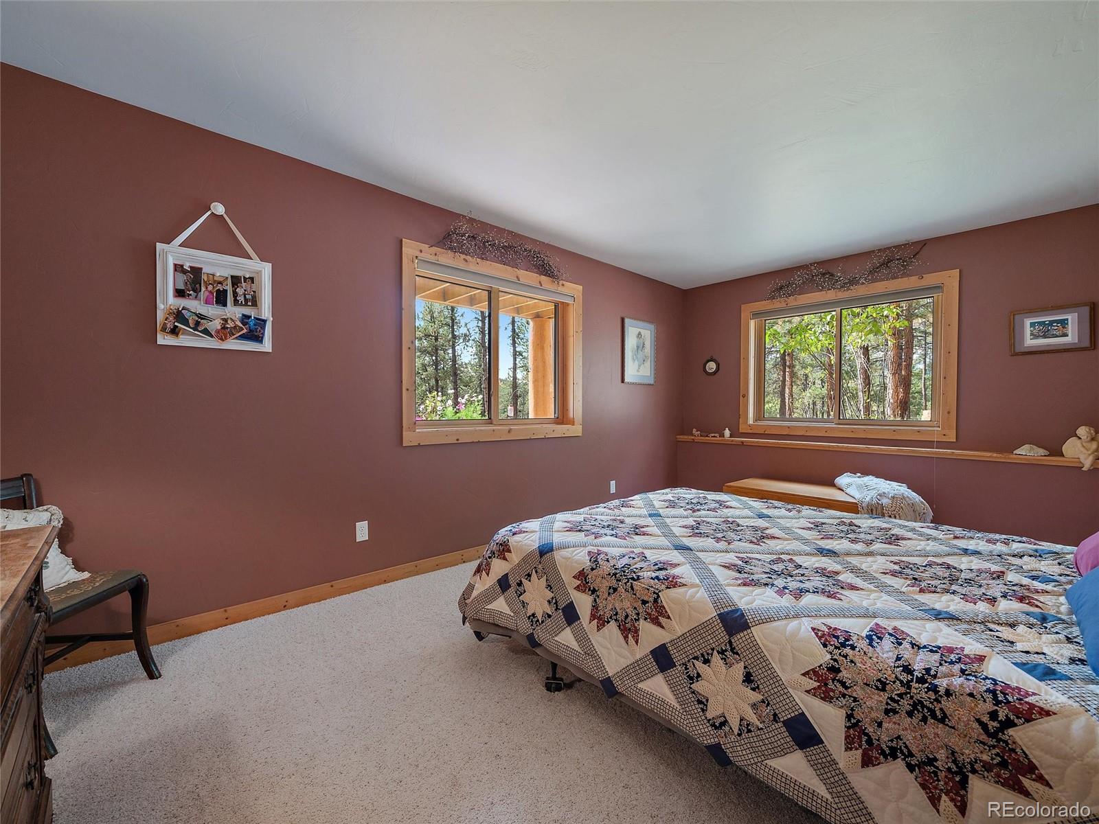 96 Six Bits Street Bailey, CO 80421 - Photo 35 of 40 a bedroom with a bed and a window