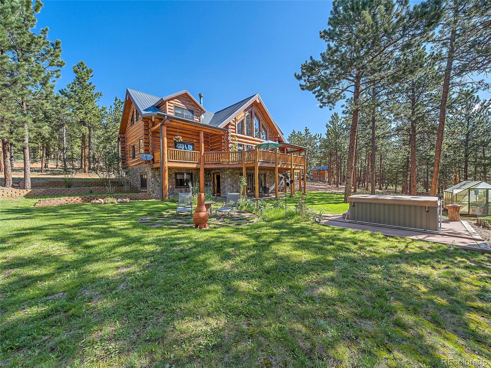 96 Six Bits Street Bailey, CO 80421 - Photo 36 of 40 a front view of a house with garden