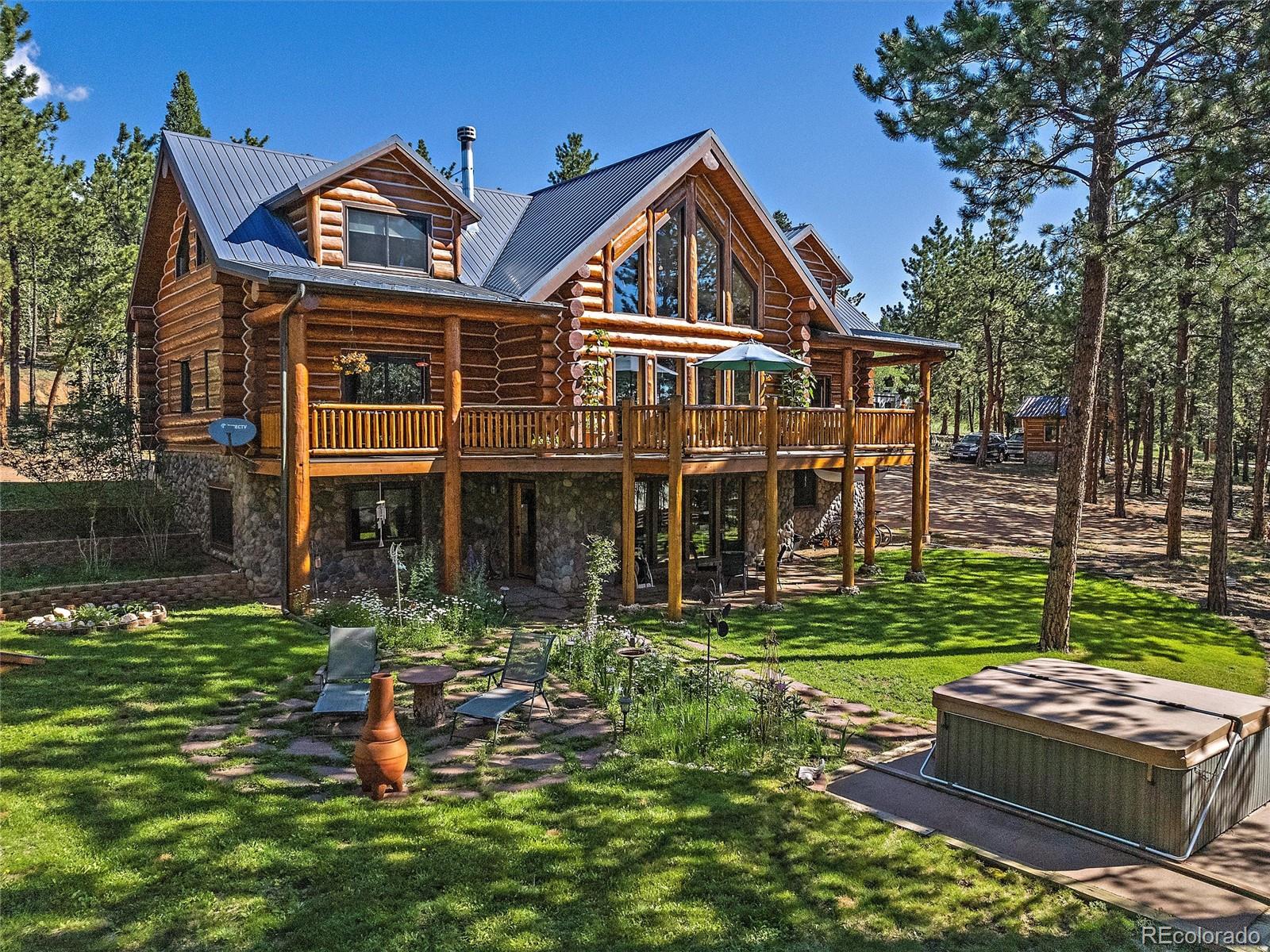 96 Six Bits Street Bailey, CO 80421 - Photo 37 of 40 a front view of a house with a yard