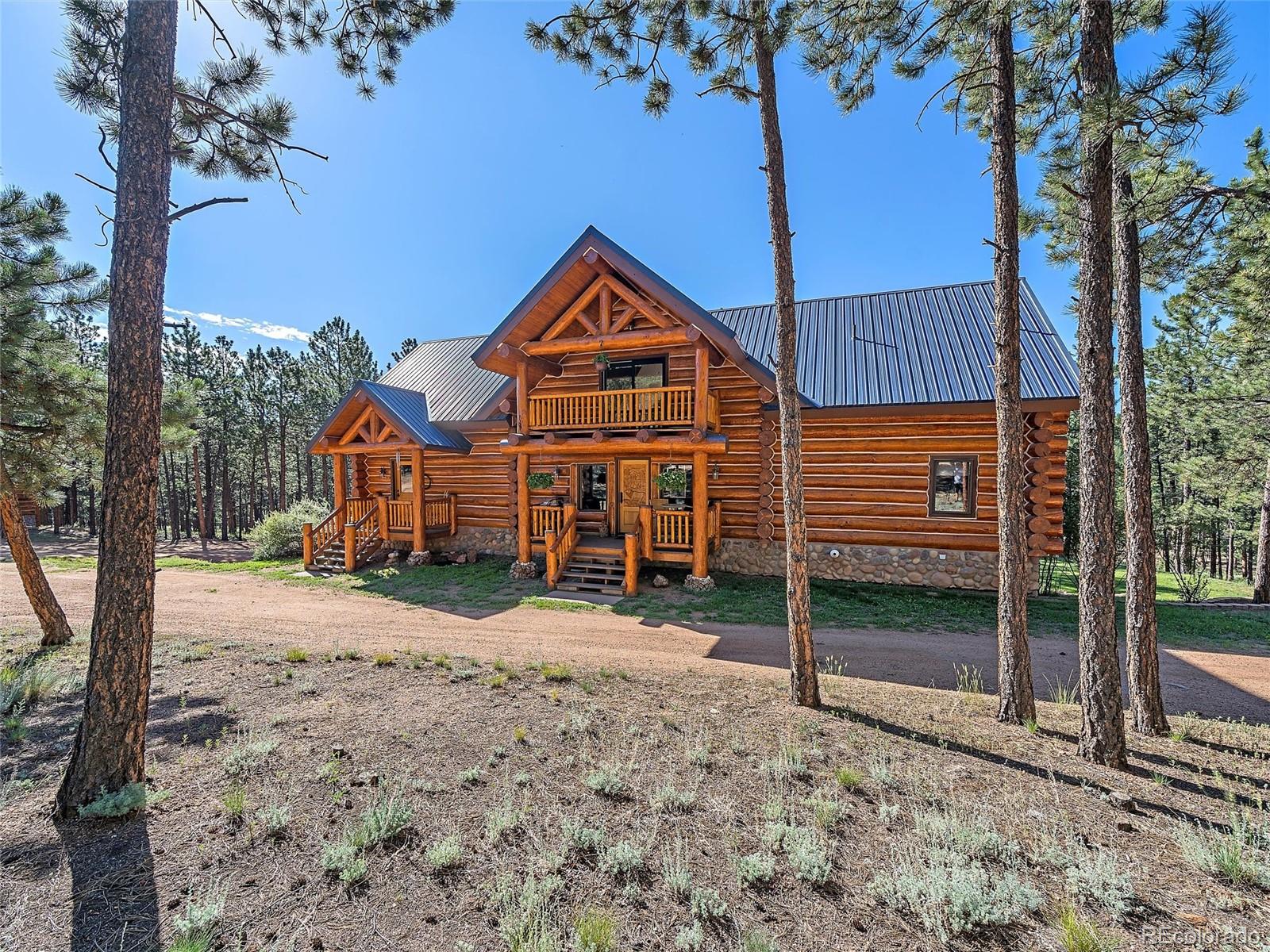 96 Six Bits Street Bailey, CO 80421 - Photo 10 of 40 a front view of a house with a yard
