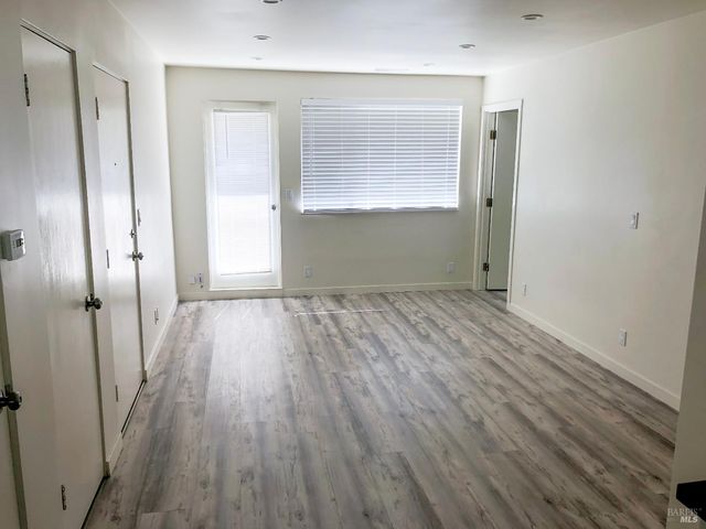 a view of wooden floor in an empty room