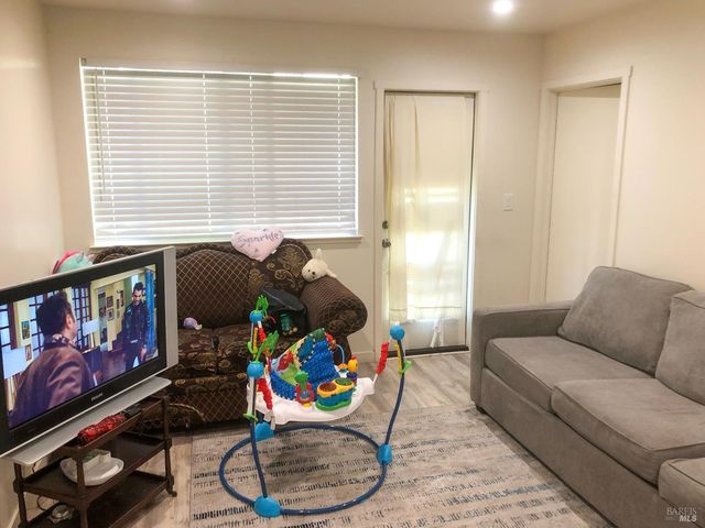 a living room with furniture and a window