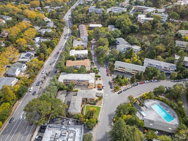an aerial view of residential houses with outdoor space