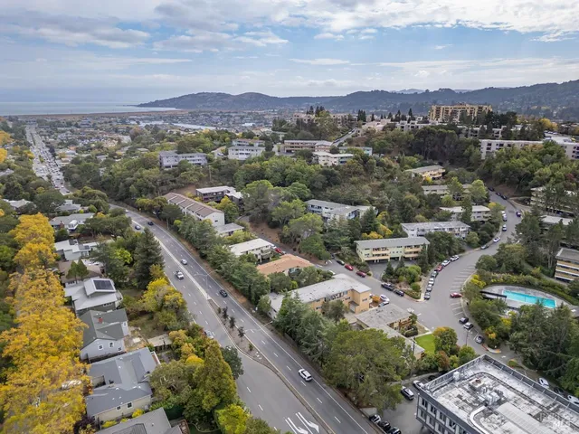 an aerial view of city and lake