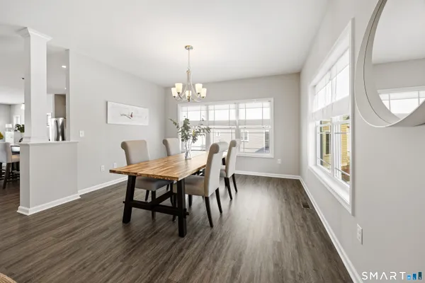 a view of a dining room with furniture window and wooden floor