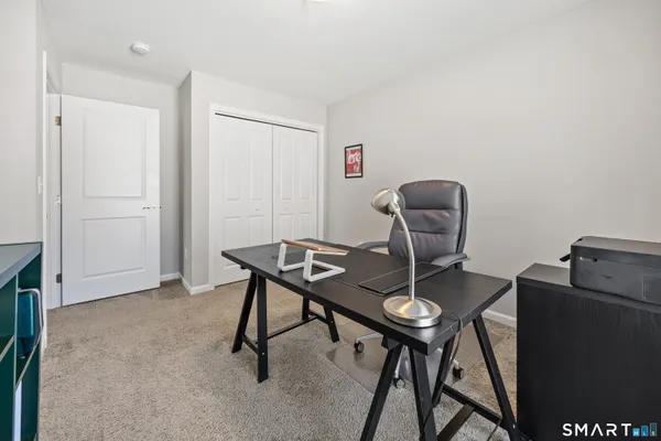 a view of a workspace with furniture
