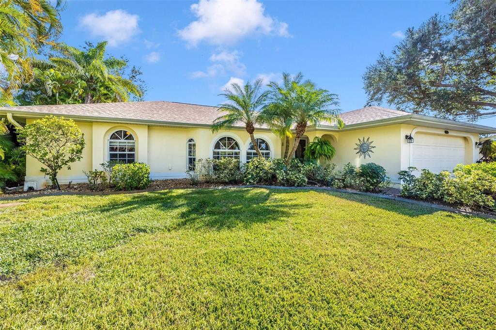 552 McCabe Street Port Charlotte, FL 33953 - Photo 1 of 1 a front view of a house with garden