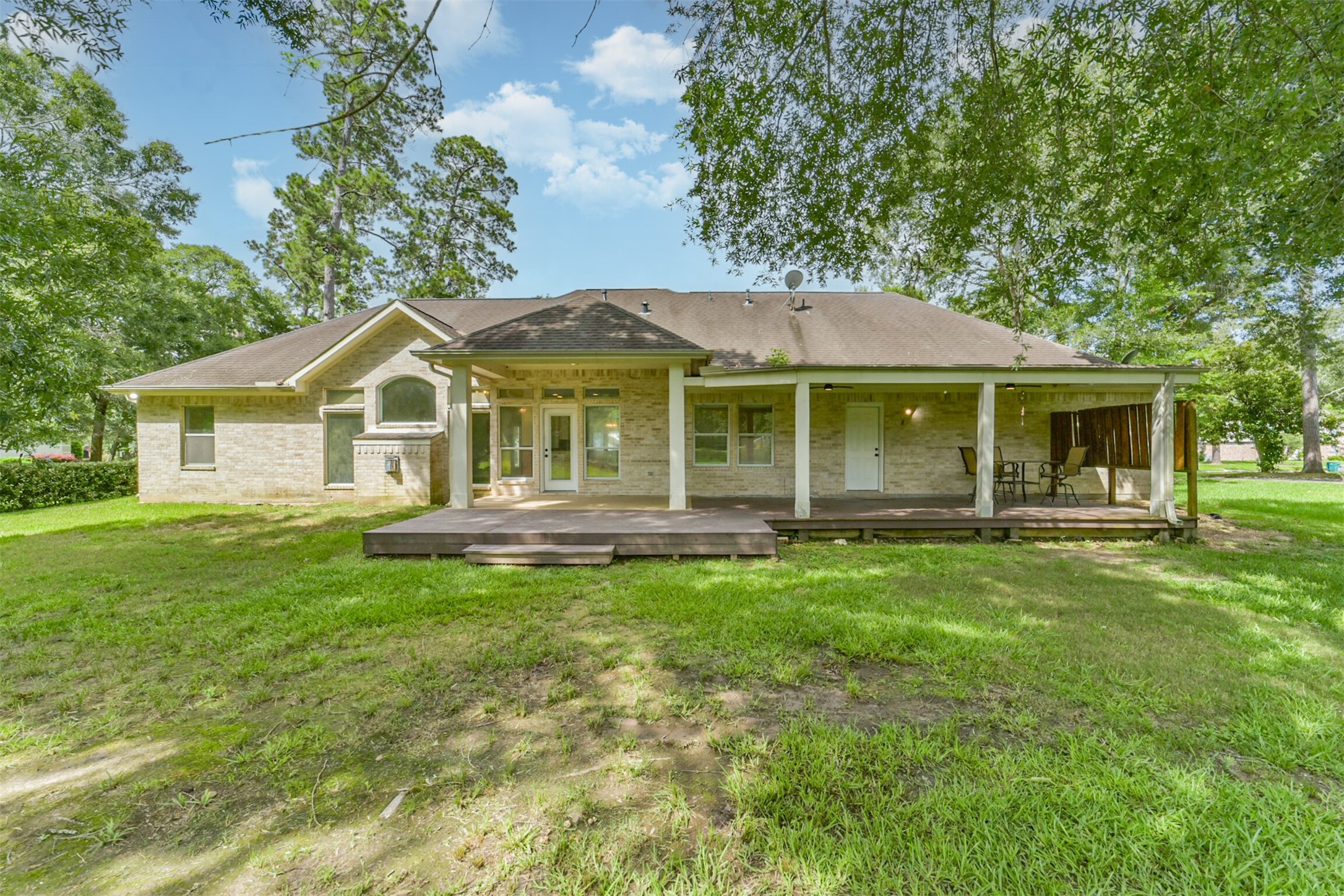 27322 Afton Way Huffman, TX 77336 - Photo 45 of 50 Spacious covered deck and patio area create the ideal backdrop for gatherings, morning coffee, or sunset evenings outdoors.