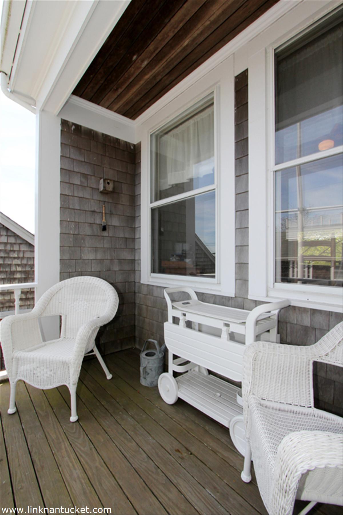 8 C Cliff Road, Unit C Nantucket, MA 02554 - Photo 18 of 20 a living room with furniture and a large window