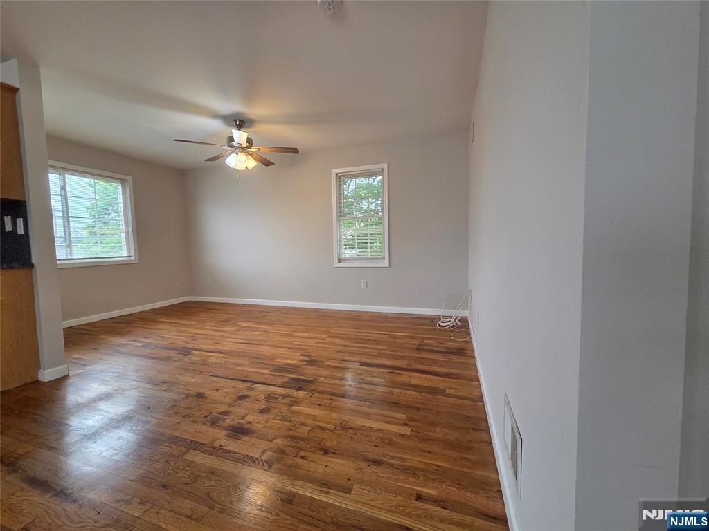 22 Broadway, Unit 2 Hackensack, NJ 07601 - Photo 6 of 11 wooden floor in an empty room with a window