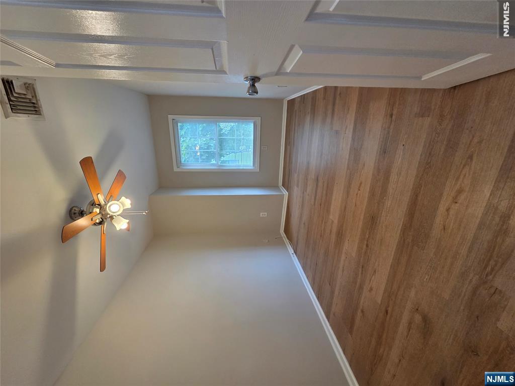22 Broadway, Unit 2 Hackensack, NJ 07601 - Photo 7 of 11 a view of an empty room with window and wooden floor