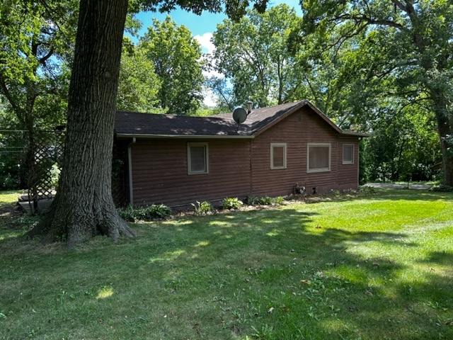 27678 West Stonegate Drive Spring Grove, IL 60081 - Photo 2 of 20 a brick house with a small yard