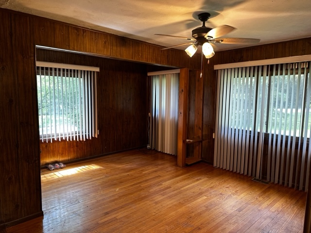 27678 West Stonegate Drive Spring Grove, IL 60081 - Photo 6 of 20 wooden floor in an empty room with a window