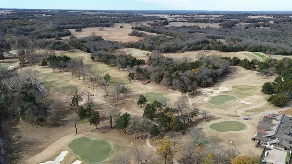 a view of a backyard of the house