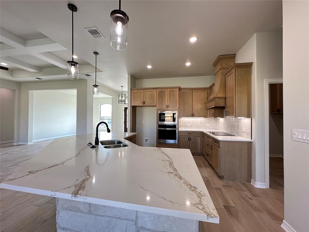403 Rusty Spur Lorena, TX 76655 - Photo 13 of 29 a large kitchen with kitchen island a sink stainless steel appliances and cabinets