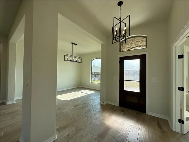 a view of livingroom with hardwood floor and hallway