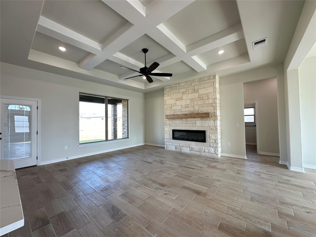 403 Rusty Spur Lorena, TX 76655 - Photo 10 of 29 an empty room with windows and fireplace