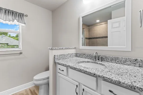a bathroom with a shower and a bath tub