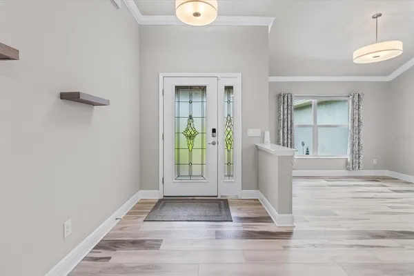 a view of entryway with wooden floor and a rug