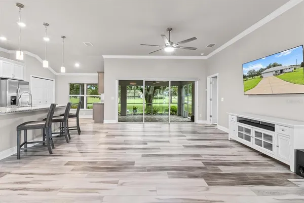 a view of kitchen with granite countertop window and a fireplace