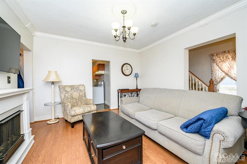 105 New Market Road Dunellen, NJ 08812 - Photo 14 of 39 a living room with furniture and a fireplace