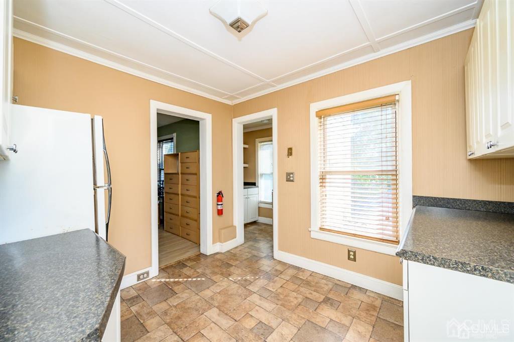 105 New Market Road Dunellen, NJ 08812 - Photo 19 of 39 a bathroom with a granite countertop sink and a bathtub