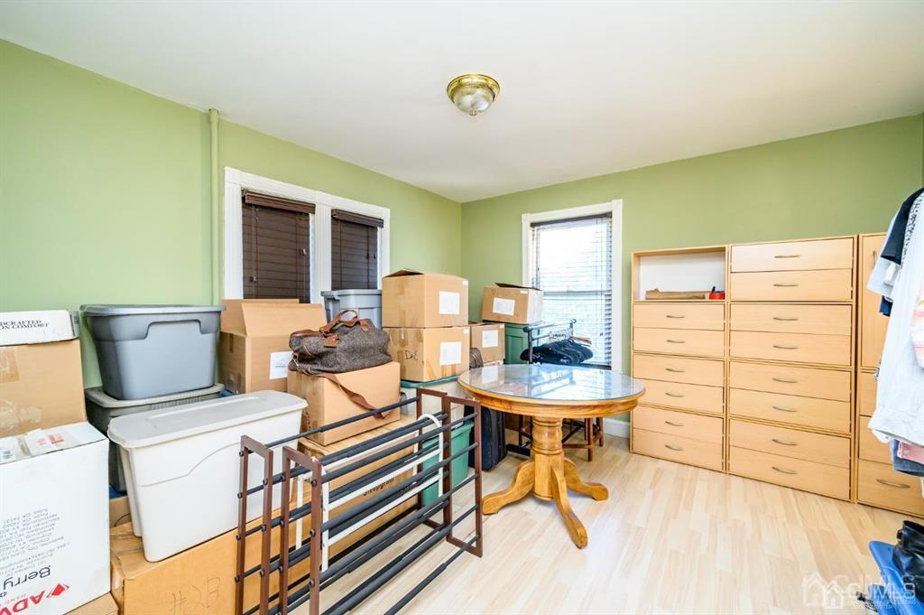 105 New Market Road Dunellen, NJ 08812 - Photo 23 of 39 a view of a dining room with furniture and a window