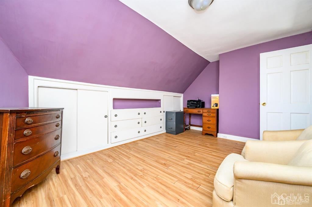 105 New Market Road Dunellen, NJ 08812 - Photo 33 of 39 a bed room with a bed and dresser