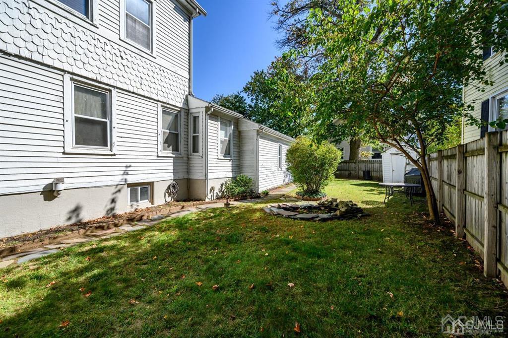 105 New Market Road Dunellen, NJ 08812 - Photo 35 of 39 a front view of house with yard and green space
