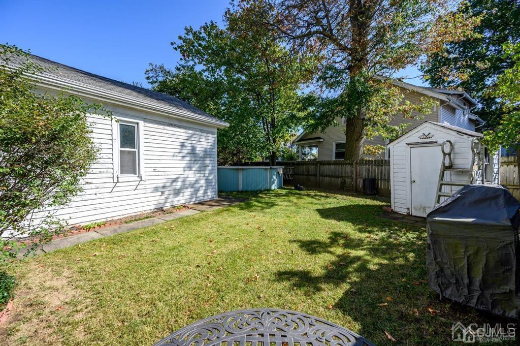 105 New Market Road Dunellen, NJ 08812 - Photo 36 of 39 a backyard of a house with yard and outdoor seating